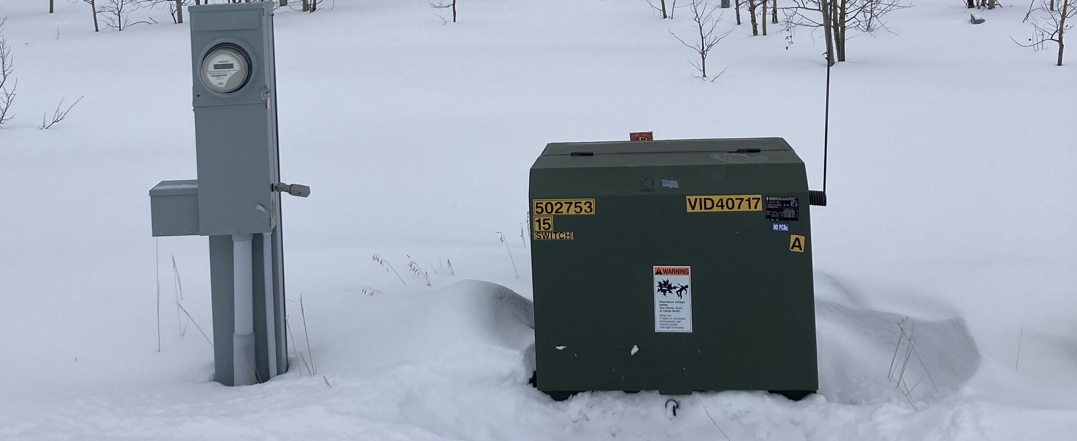meter pedestal next to a transformer